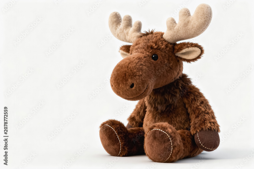 Fototapeta premium A soft brown plush moose stuffed toy sits against a plain white background, designed as a cute children's item.