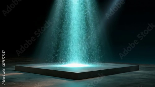 Square platform emitting light particles in dark studio