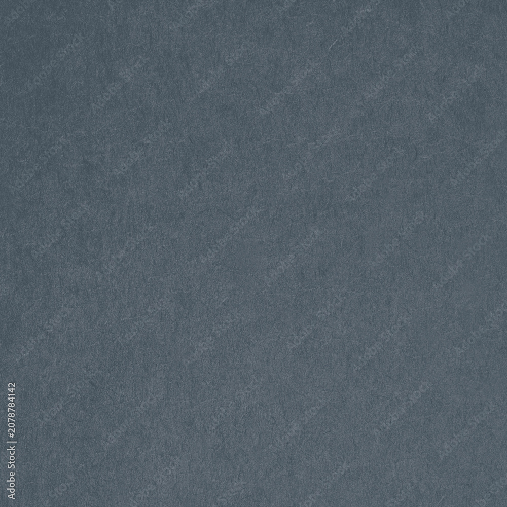 Fototapeta premium Textured dark blue paper background with a subtle grainy appearance.