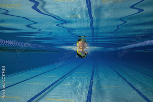Underwater Photo of Young Female Athlete Swimming in Pool.
