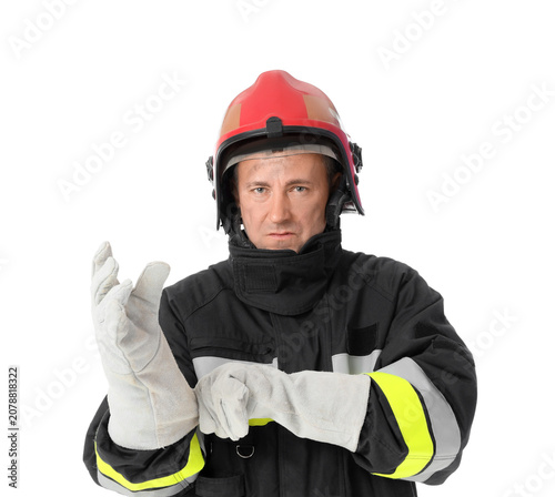 Mature male firefighter put...