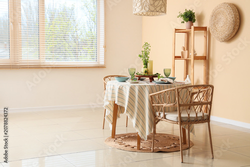 Served dining table with pl...