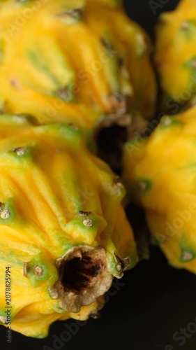 Group of whole raw exotic yellow pitahaya dragonfruits