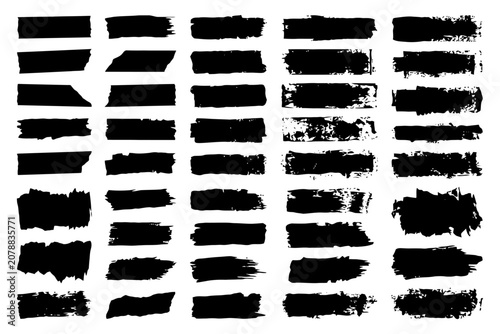 Set of black grunge brush stroke rectangles on white background.