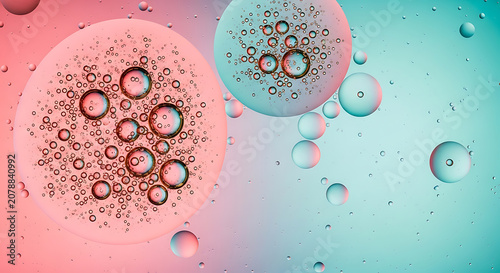 Bubbles in water with pink and teal hues a macro photographic composition