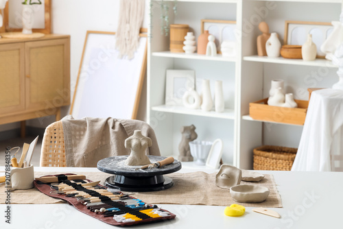 Sculptors workplace with cl...