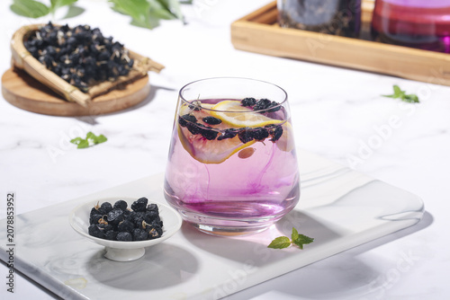 Cuadro en lienzo Traditional Chinese Black Wolfberry Tea Hot Herbal Drink with Goji Berries and M