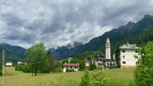 Italy rural village in picturesque mountain valley Dolomites Alps