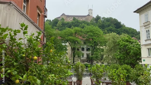 Ljubljana pan across city square towards riverside Slovenia