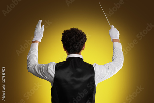 Young male conductor on dar...