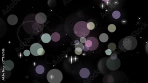 Bokeh circles in purple and white hues float against a deep black background with shimmering stars.