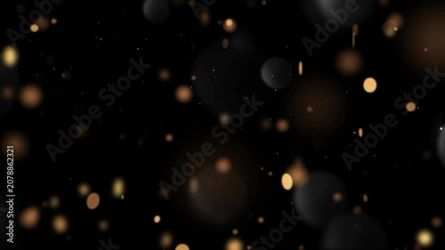 Golden bokeh circles drift through the dark space providing a warm and festive visual texture.