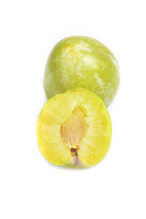 Fresh Chilean Dinosaur Egg Plum Cut in Half Showing Yellow Flesh Studio Photography