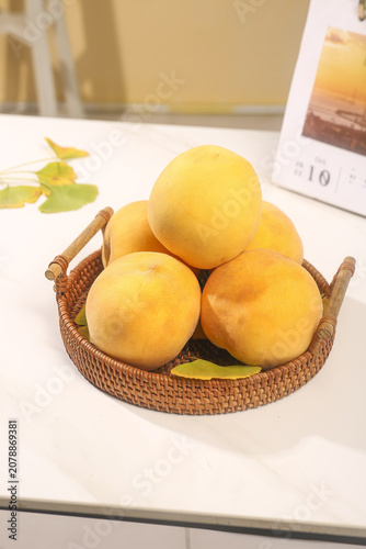 Fresh Yellow Peaches in Wicker Basket Kitchen Counter Still Life Studio Photography