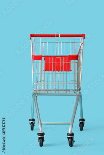Shopping cart on blue backg...