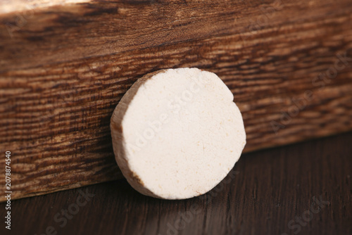 Quadro su tela Fresh Yam Slice on Wooden Background - Root Vegetable Studio Food Photography