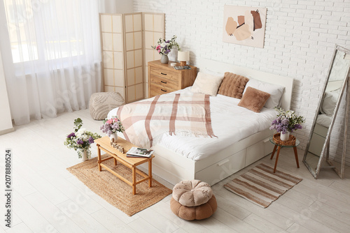 Interior of light bedroom w...
