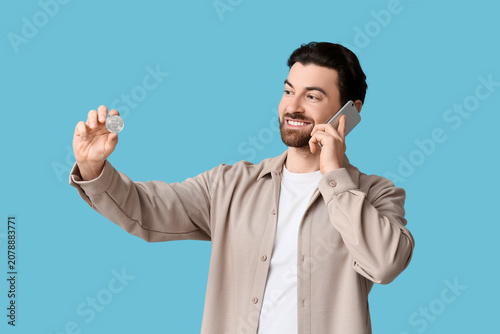 Handsome man with bitcoin t...