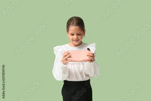 Cute little happy girl with...