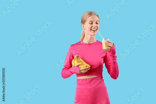 Happy sporty young woman wi...