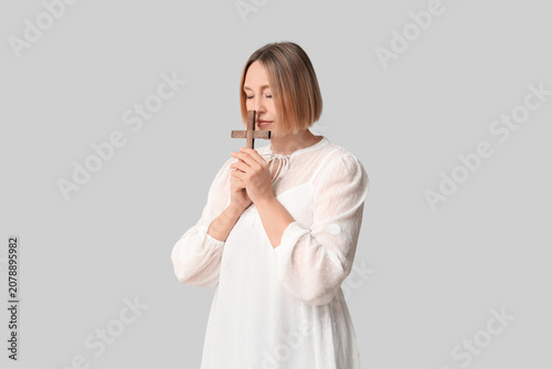Adult woman with wooden cro...