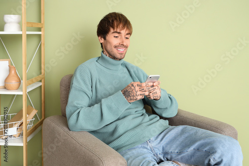 Handsome man using mobile p...