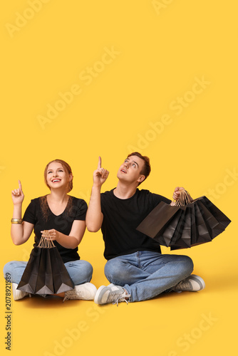 Young couple with shopping ...
