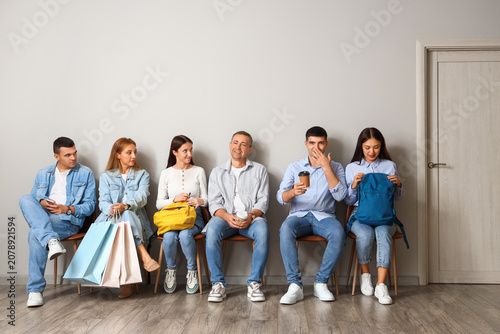 People waiting for their tu...