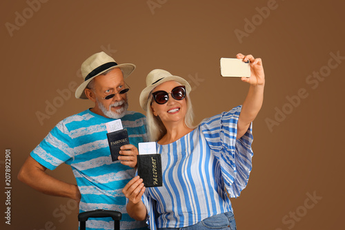 Senior couple with passport...