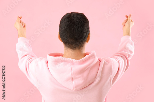 Young man making heart with...