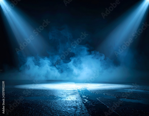 Dramatic Blue Stage Spotlights Illuminating Smoke and Fog on a Dark Surface.