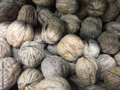 close up of a pile of walnuts on the market
