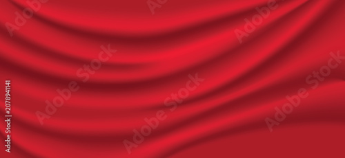 Φωτογραφία Red silk and satin fabric background with smooth waves