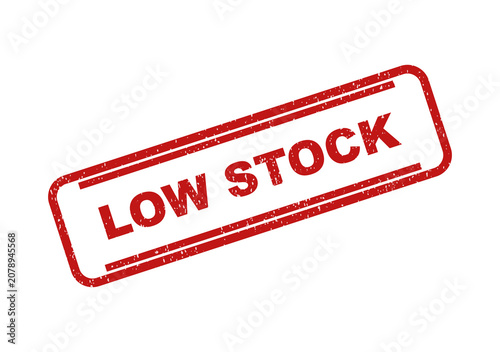 Red grunge rubber stamp impression with the text low stock inside