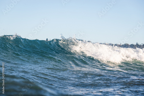 Small breaking wave at the beach.