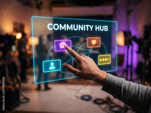 Community hub concept with connected people, chat, and heart icons on a glowing futuristic screen with blurred background of people in studio.