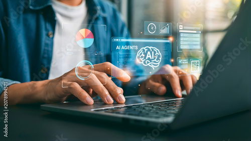 Person interacting with artificial intelligence agents and digital data visualization on a laptop
