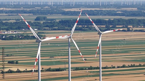 Wind turbines across agricultural fields in summer, Austrian Burgenland