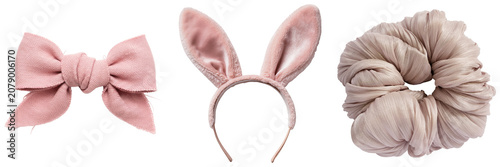 Foto Pink fabric bow, bunny ears headband, and scrunchie isolated on white background