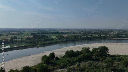 River Po experiencing extreme low water levels due to drought and climate change, revealing sandbanks and impacting water scarcity in Lombardy and Emilia Romagna, Italy