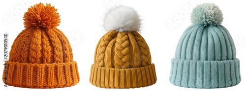 Photos Three knitted winter hats with pom-poms in orange, mustard yellow, and light blue, isolated on a white background