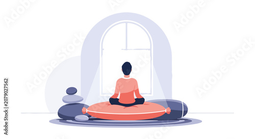 Canvas-taulu A man sits in a meditative lotus pose on a plush cushion, facing a bright window to find inner peace and mindfulness