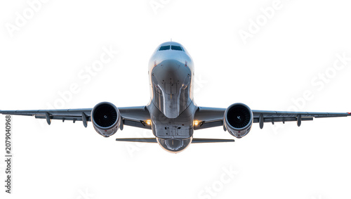 Fotografie Isolated commercial passenger airplane flying directly towards camera, detailed