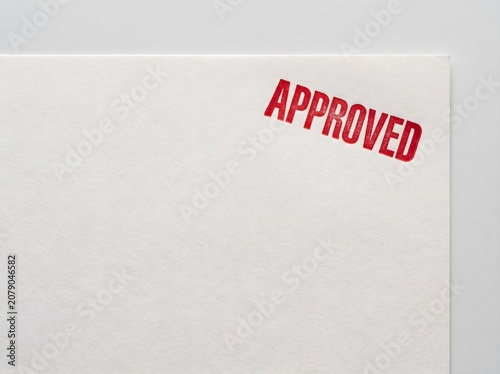 Red approved stamp ink on blank white paper document with copy space