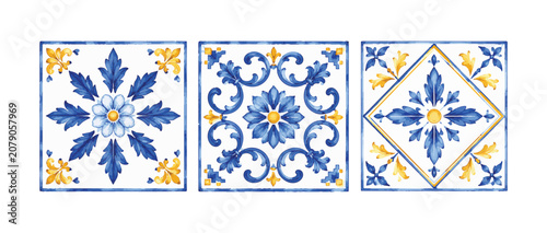 Three ornate ceramic tiles with blue and yellow floral patterns.