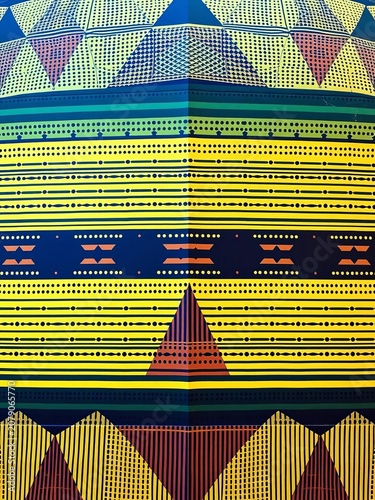 Large, geometric shape with repeating patterns of lines and dots, pattern, lines