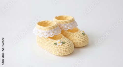 Baby photo for nursery decor with crochet booties and soft pastel handmade style