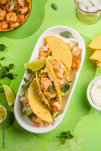 Mexican tacos with shrimp, fresh vegetables and lime