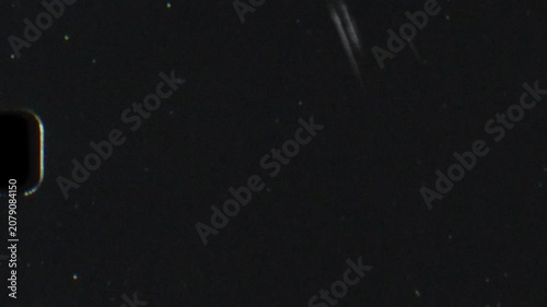 Vintage 8mm film leader overlay with heavy dust, grain, and scratches on a dark background. Authentic retro cinema celluloid featuring flashing countdown numbers, text, and analog damage effects.