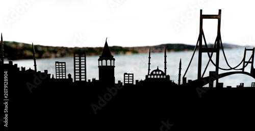 Conceptual travel souvenir featuring Galata Tower and Bosphorus Bridge silhouette